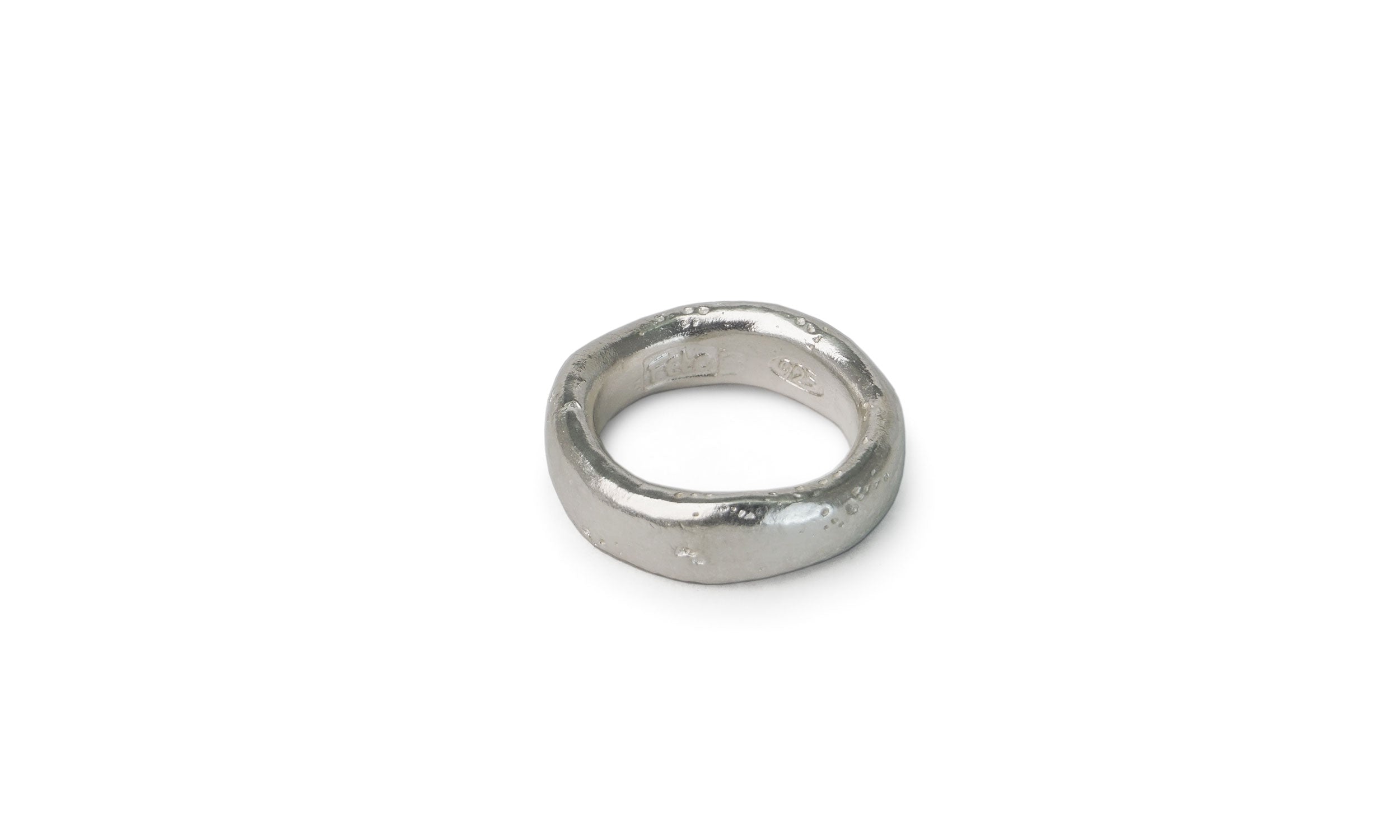 Silver ring on a white background